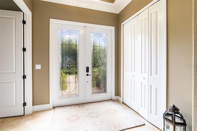 entryway with french doors and light tile patterned flooring