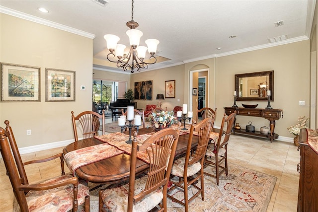 dining room featuring ornamental molding, a notable chandelier, and light tile patterned floors