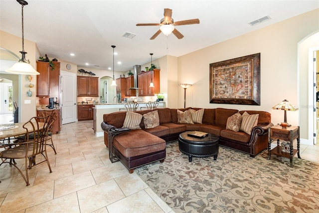 living room with light tile patterned floors and ceiling fan