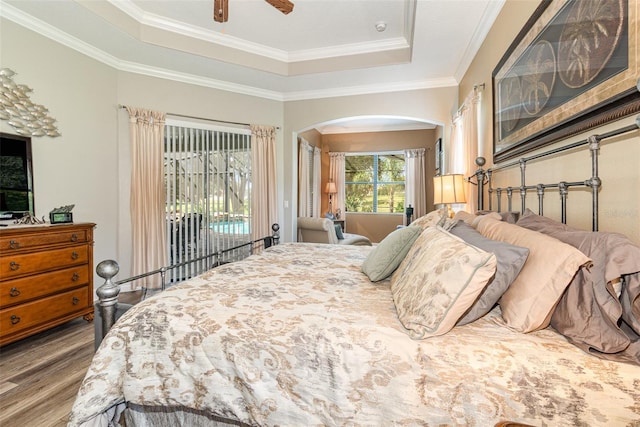 bedroom featuring wood-type flooring, access to exterior, ornamental molding, and ceiling fan