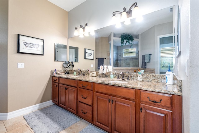 bathroom featuring vanity, a shower, and tile patterned floors