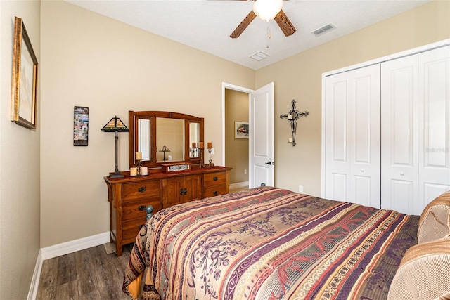 bedroom with ceiling fan, a closet, and dark hardwood / wood-style floors