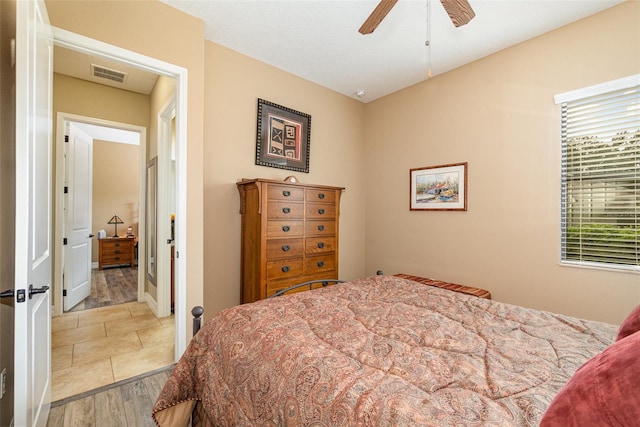 bedroom with ceiling fan and light hardwood / wood-style floors