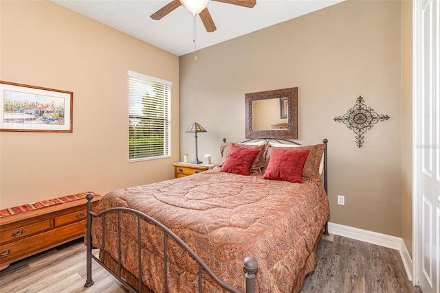 bedroom featuring ceiling fan and hardwood / wood-style floors