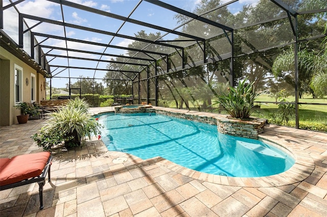 view of pool featuring a patio, an in ground hot tub, and a lanai