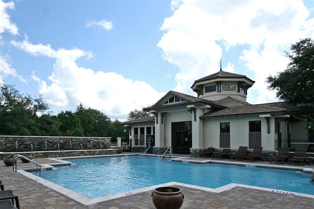 view of pool featuring a patio area