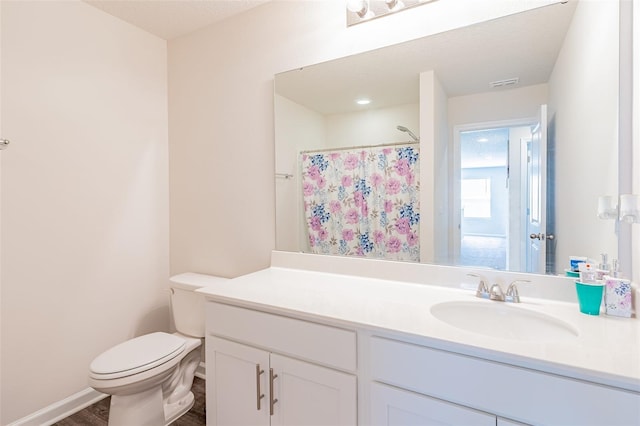 bathroom featuring vanity, toilet, a shower with shower curtain, and hardwood / wood-style flooring