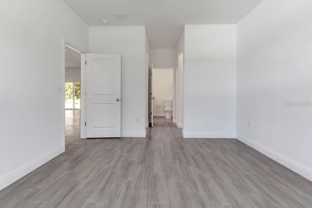 unfurnished room featuring light hardwood / wood-style flooring