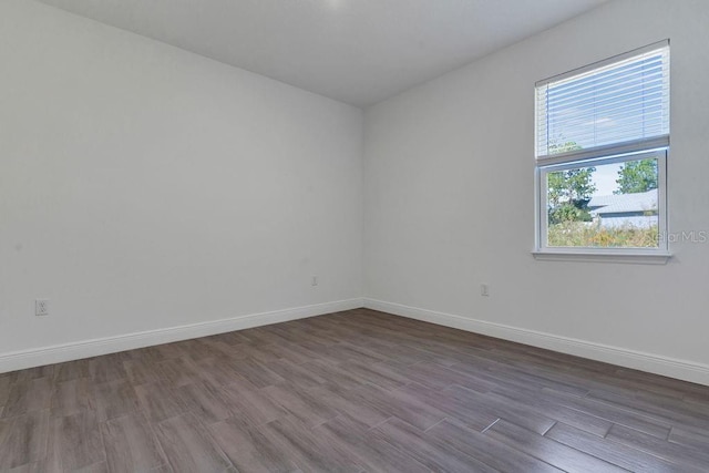 unfurnished room featuring hardwood / wood-style floors