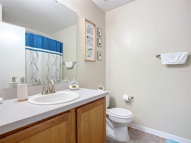 bathroom featuring vanity, toilet, and tile patterned floors