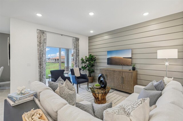 living room featuring wood walls