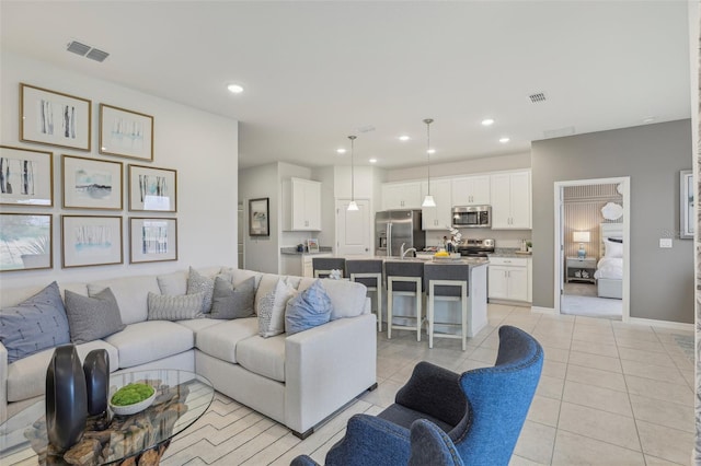 living room with light tile patterned floors