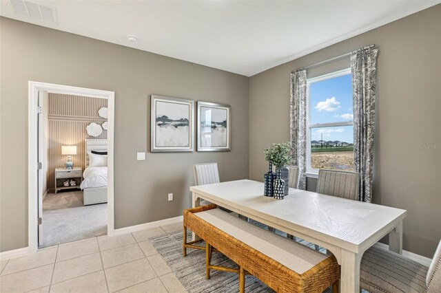 dining area with light tile patterned floors