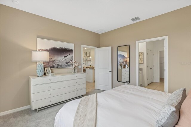 bedroom featuring light colored carpet