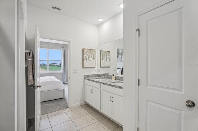 bathroom featuring vanity and tile patterned flooring