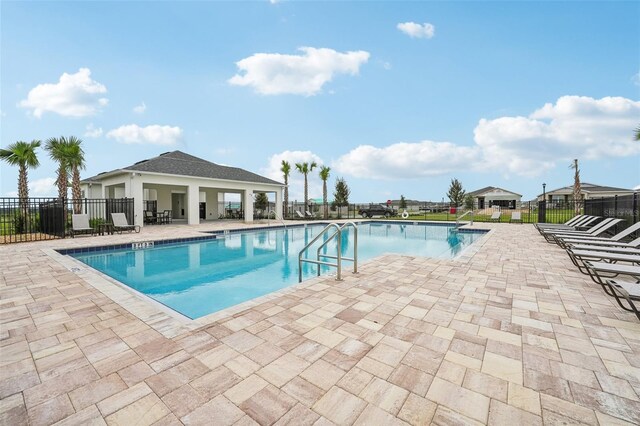 view of swimming pool featuring a patio