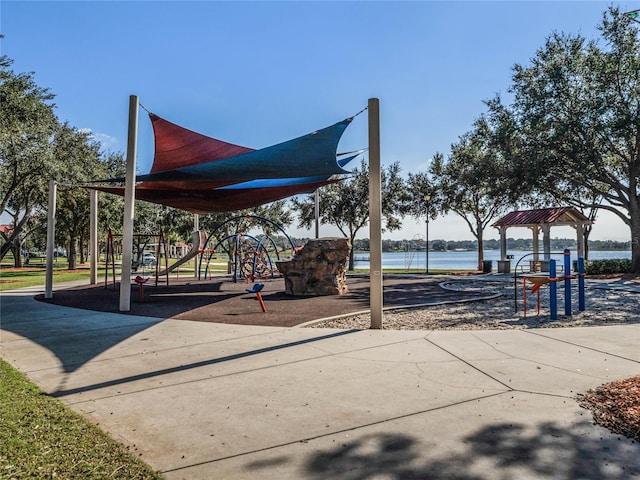 view of jungle gym featuring a water view