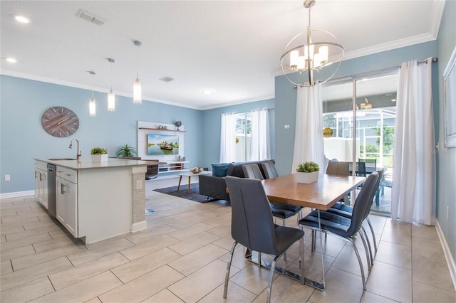 dining room featuring an inviting chandelier, ornamental molding, and sink