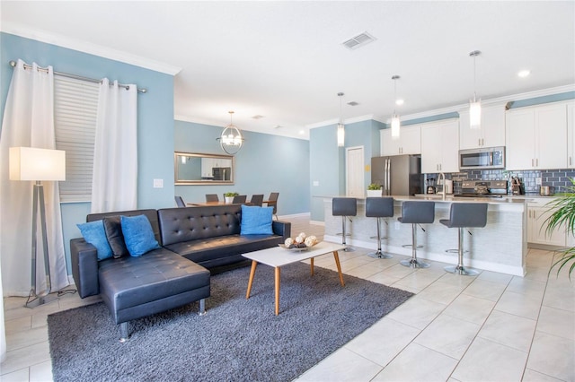 living room featuring crown molding and light tile patterned floors