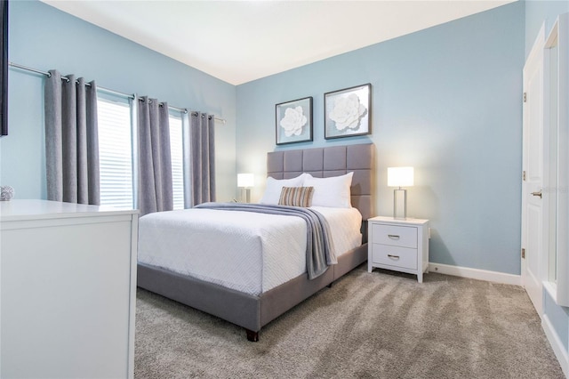 bedroom with light colored carpet