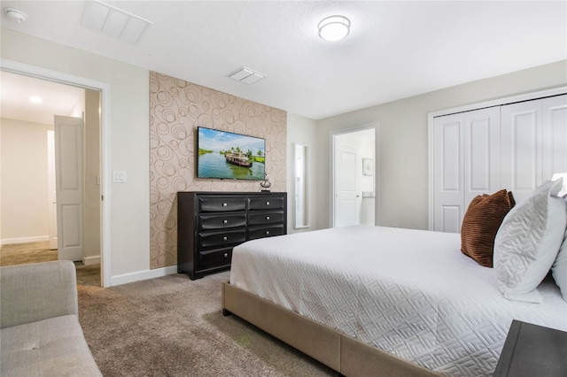 carpeted bedroom featuring a closet