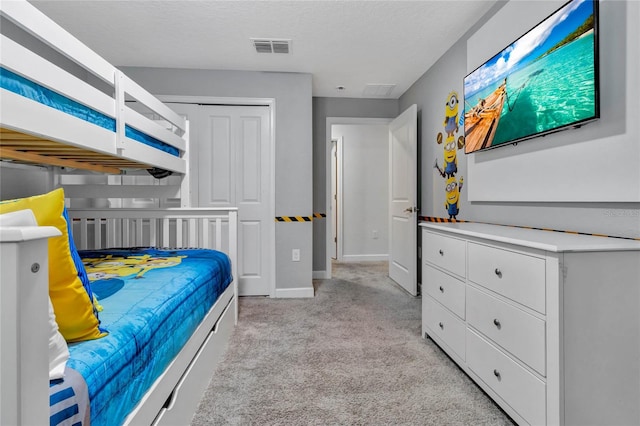 bedroom featuring light colored carpet