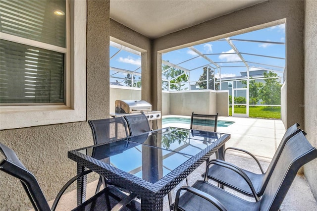 view of patio featuring grilling area, a hot tub, and a lanai