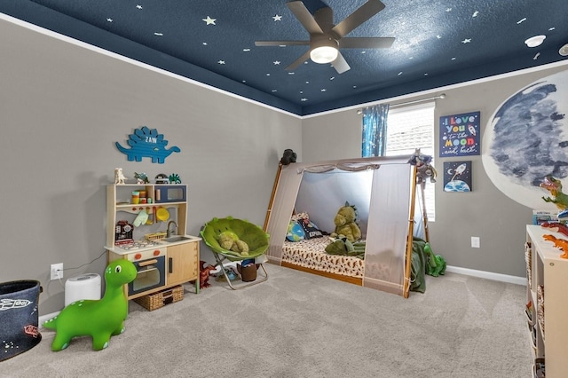 bedroom with a textured ceiling, carpet flooring, and ceiling fan