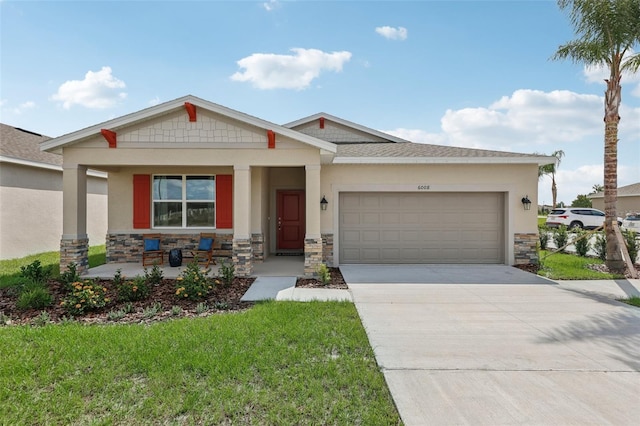 12965 Trovita Dr, Grand Island, FL 32735 - craftsman-style home featuring stone siding, covered porch, a garage, and concrete driveway