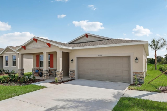 12965 Trovita Dr, Grand Island, FL 32735 - craftsman-style house featuring an attached garage, stone siding, stucco siding, driveway, and roof with shingles
