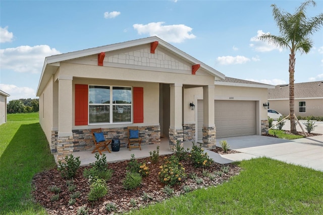 12965 Trovita Dr, Grand Island, FL 32735 - craftsman-style home with an attached garage, a porch, stone siding, a front lawn, and driveway