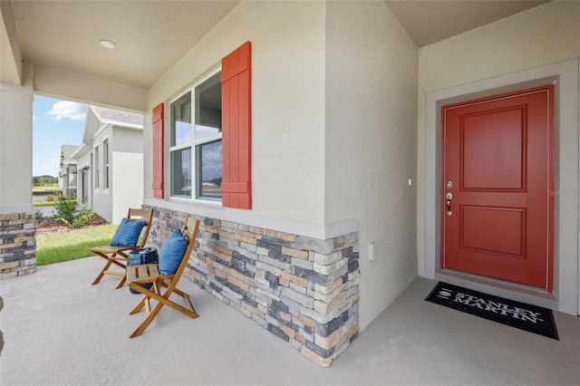 doorway to property with a porch