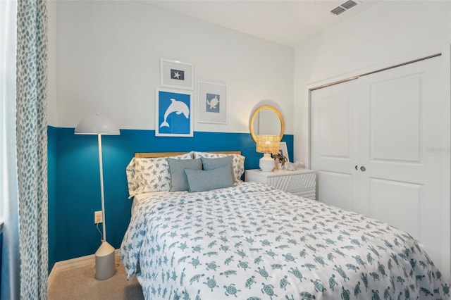 carpeted bedroom featuring a closet