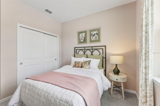 bedroom featuring a closet and carpet flooring