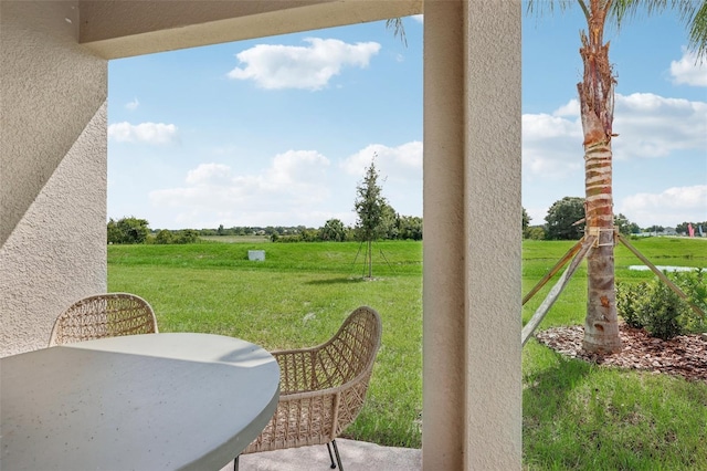 view of yard with a rural view