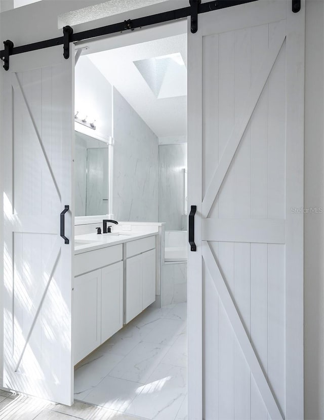 bathroom featuring vanity and a washtub