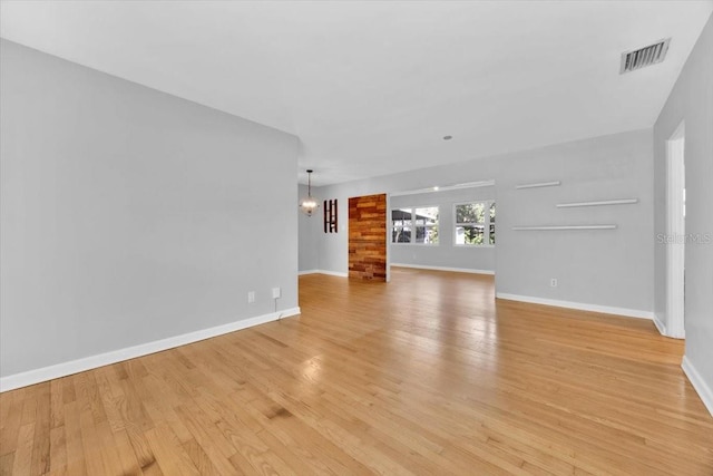 unfurnished living room featuring light wood-type flooring