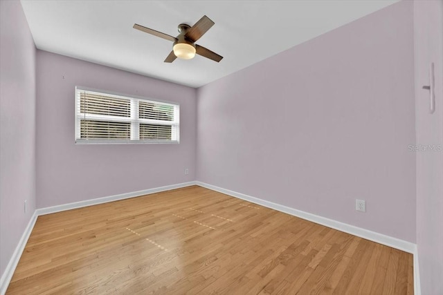 empty room with ceiling fan and light wood-type flooring