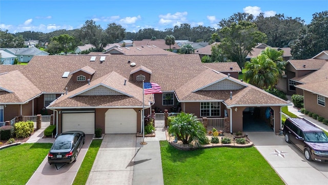 view of front of property featuring a garage and a front yard