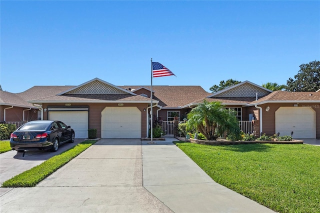 ranch-style home featuring a front yard and a garage