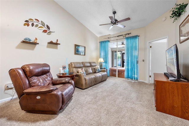 carpeted living room with vaulted ceiling, a textured ceiling, and ceiling fan