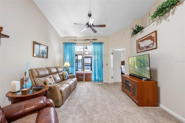 carpeted living room with ceiling fan