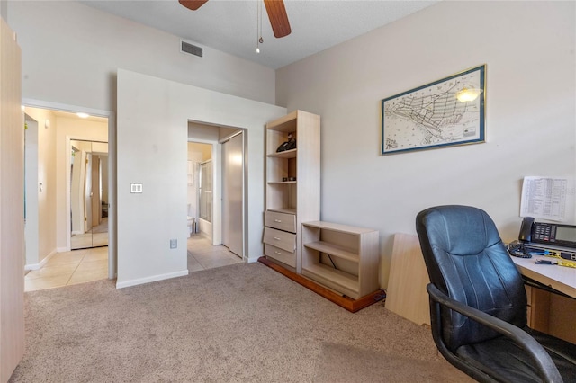 carpeted office with ceiling fan