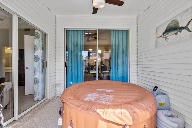 view of patio with a jacuzzi and ceiling fan