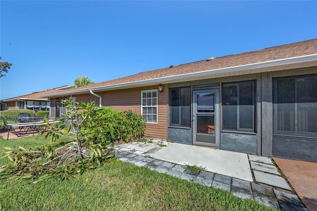 rear view of house with a patio