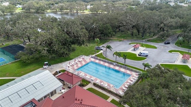 birds eye view of property with a water view