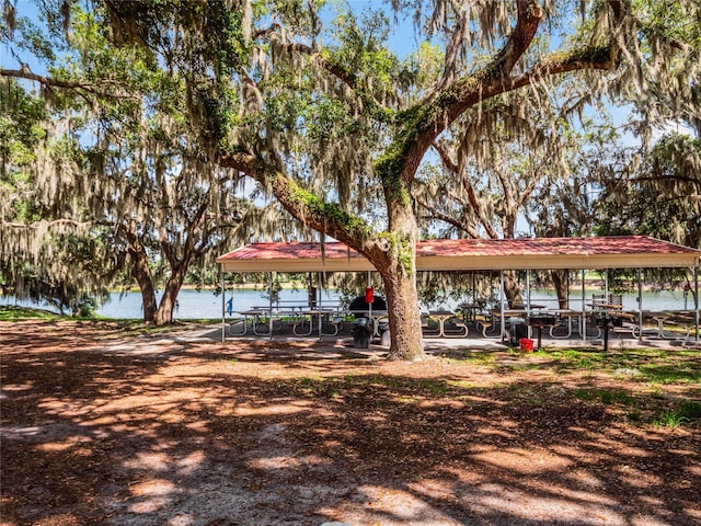 view of community featuring a gazebo and a water view