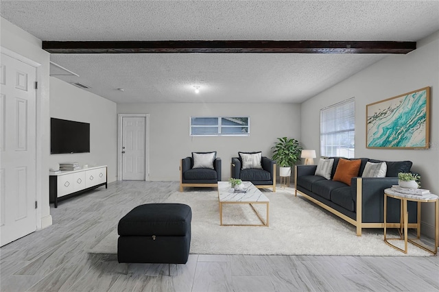 living room with beamed ceiling and a textured ceiling