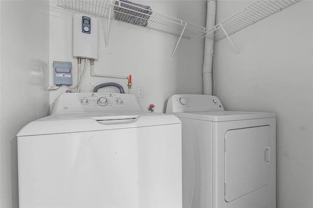 laundry area with washing machine and dryer