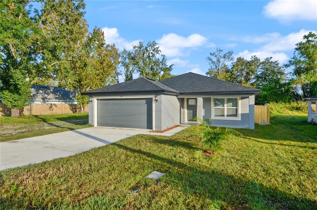 ranch-style house featuring a front lawn and a garage